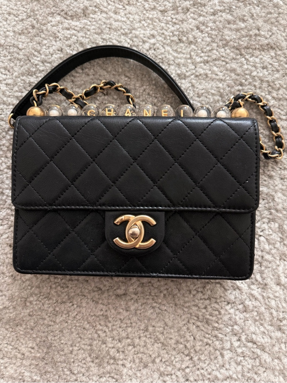 Authentic Chanel Black Quilted Lambskin Crossbody with Gold clear Pearl Flagbag